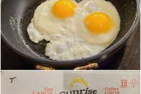 eggs cooking sunnyside up in a pan